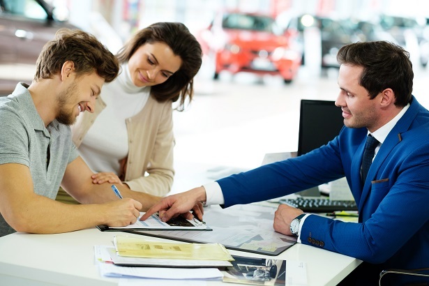 first time car shopper signing contract