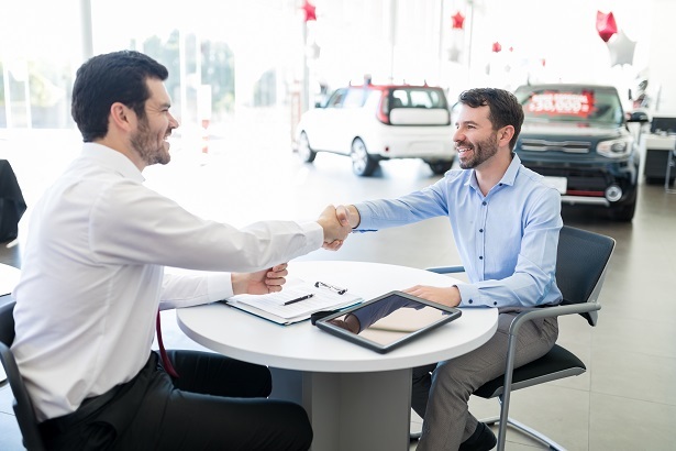 dealer car shopper handshake